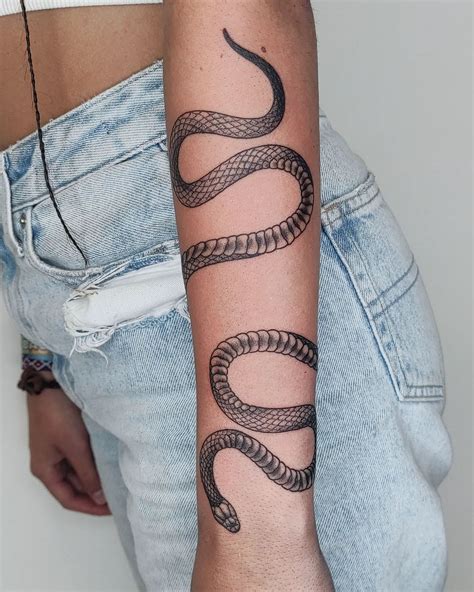 snake wrapped around leg tattoo meaning|Snake Tattoo Meaning (with Images)